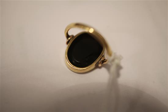 A Roman green chalcedony intaglio in a later gold ring mount, size C.